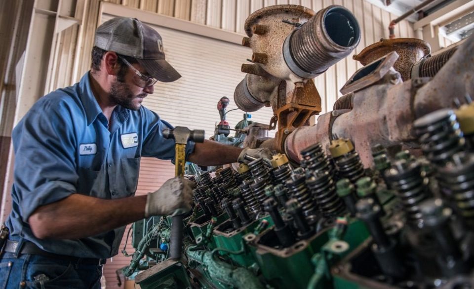 Cat tech working on an engine